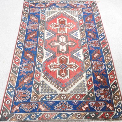 Lot 484 - A Turkish rug, with three central hooked...