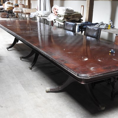 Lot 22 - A large reproduction mahogany triple pillar boardroom table