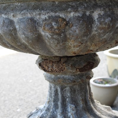 Lot 24 - A cast stone garden urn, on a pedestal base,...