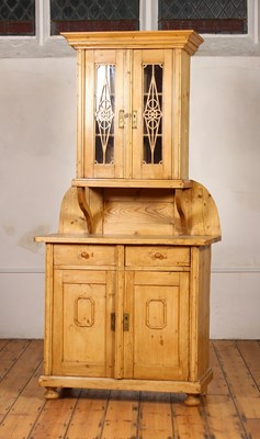 Lot 275 - A pine dresser, the glazed upper section above...