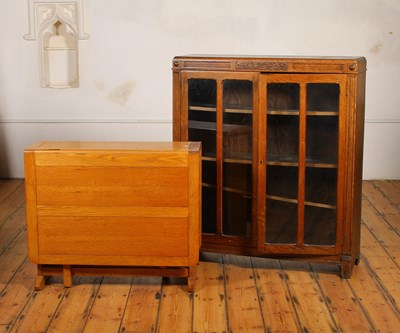 Lot 485 - A 1920s oak glazed bookcase, w.108cm, together...