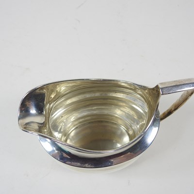 Lot 39 - A George III silver cream jug, London 1803,...