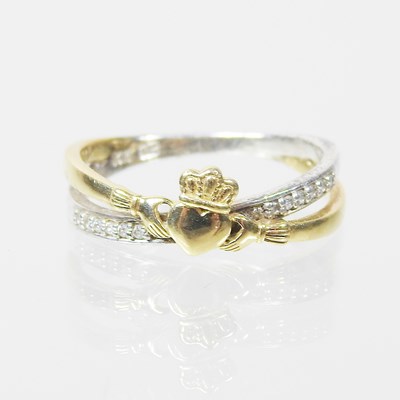 Lot 528 - A 9 carat gold Claddagh style shamrock dress...