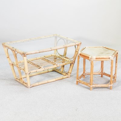 Lot 257 - A bamboo coffee table with a glass top,...