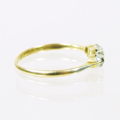 Lot 14 - An 18 carat gold three stone diamond ring,...
