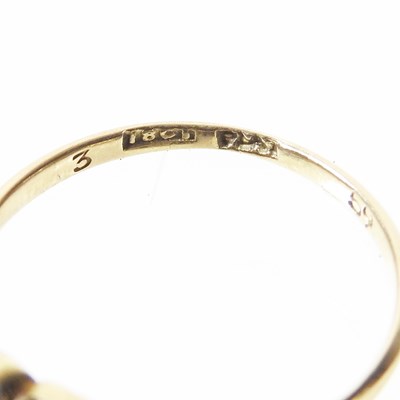 Lot 14 - An 18 carat gold three stone diamond ring,...