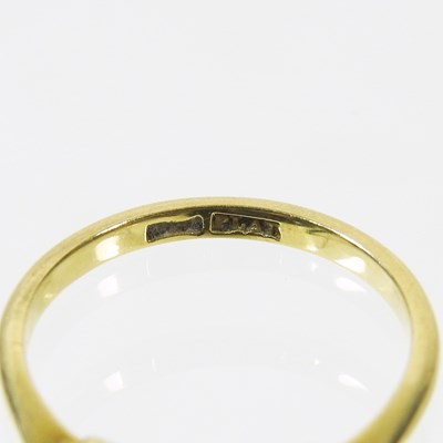 Lot 38 - A gold and platinum set five stone emerald and...