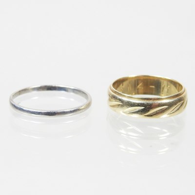 Lot 73 - A platinum wedding band, 2g, size N, together...