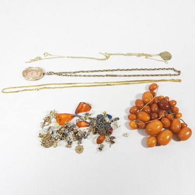 Lot 152 - An antique gilt locket on chain, together with...