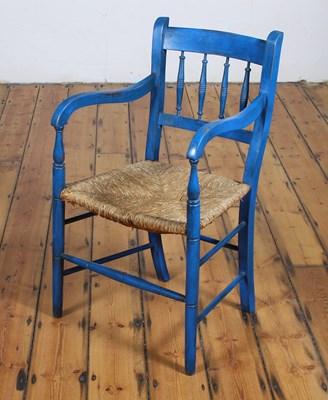 Lot 639 - A blue painted rush seated armchair