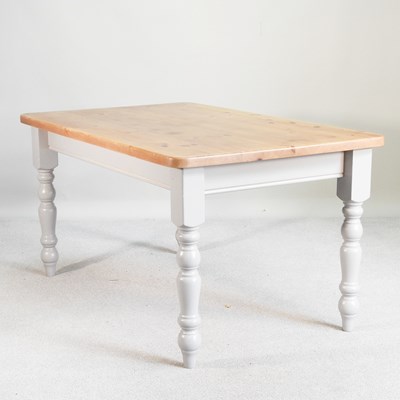 Lot 547 - A pine and painted dining table, on turned legs