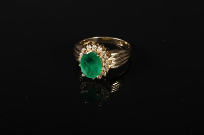 Lot 51 - A 14 carat emerald and diamond cluster ring,...
