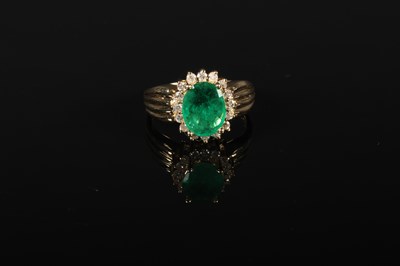 Lot 51 - A 14 carat emerald and diamond cluster ring,...