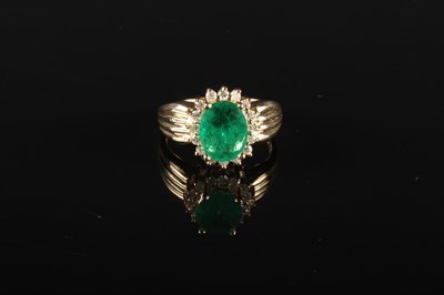 Lot 51 - A 14 carat emerald and diamond cluster ring,...