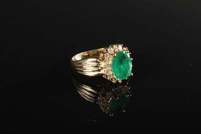 Lot 51 - A 14 carat emerald and diamond cluster ring,...