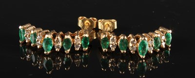 Lot 143 - A pair of yellow metal emerald and diamond...