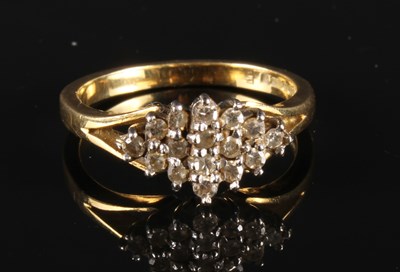 Lot 44 - An 18 carat gold sapphire and diamond dress...