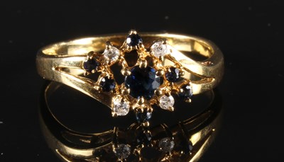 Lot 163 - An 18 carat gold sapphire and diamond dress...