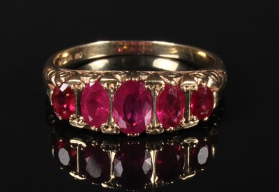 Lot 86 - A 9 carat gold ruby dress ring, with a carved...