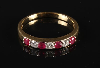 Lot 136 - An 18 carat gold ruby and diamond ring, size...
