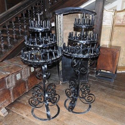 Lot 99 - A pair of black wrought iron floor candelabra