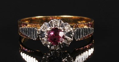 Lot 96 - An 18 carat gold ruby and diamond illusion set...