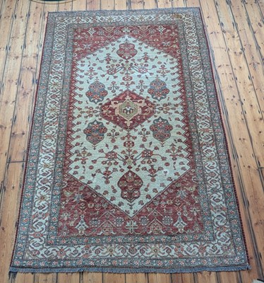 Lot 722 - A Persian rug, on a cream ground, 282 x 180cm