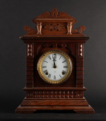 Lot 316 - An early 20th century oak cased mantel clock,...