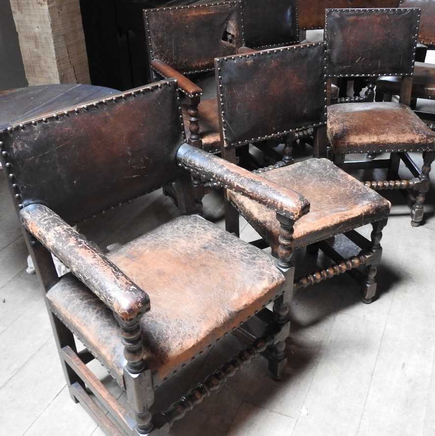 Lot 32 - A set of six oak and studded leather dining chairs