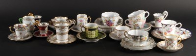 Lot 400 - A collection of mixed porcelain coffee cans,...