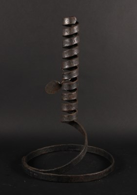 Lot 521 - A spirally wrought iron candle holder