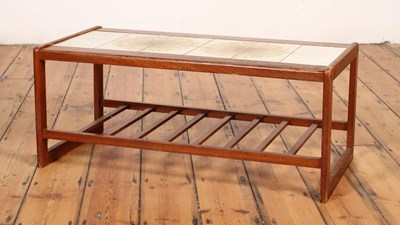Lot 440 - A mid century teak tile top coffee table