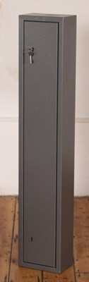 Lot 658 - A metal gun cabinet, with key