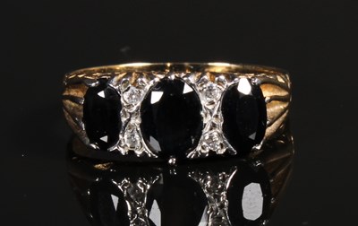 Lot 108 - A 9 carat yellow gold sapphire and diamond...