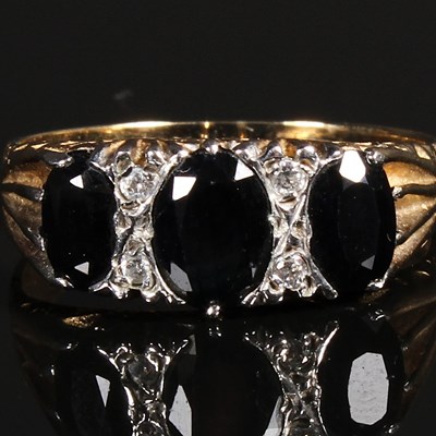 Lot 127 - A 9 carat gold sapphire and diamond dress ring,...