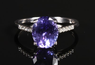 Lot 39 - An 18 carat white gold oval tanzanite ring,...