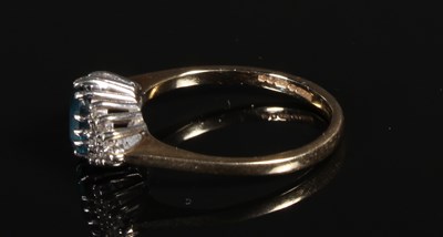 Lot 94 - A 9 carat blue topaz and diamond dress ring,...