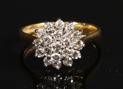 Lot 148 - An 18 carat yellow gold diamond cluster ring,...
