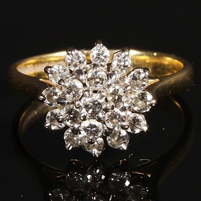 Lot 157 - An 18 carat yellow gold diamond cluster ring,...