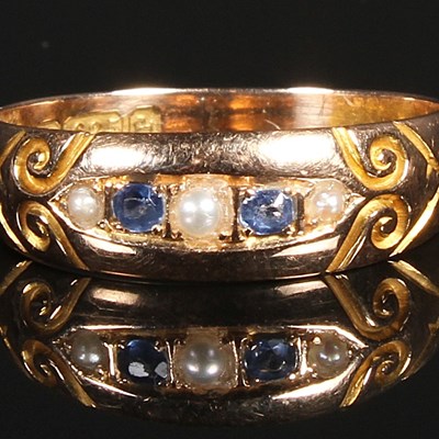 Lot 102 - A 15 carat yellow gold sapphire and seed pearl...