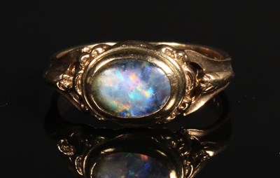 Lot 64 - A 9 carat yellow gold opal ring, size K/L, 2.4g