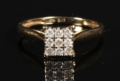 Lot 112 - A 9 carat yellow gold nine stone square set...