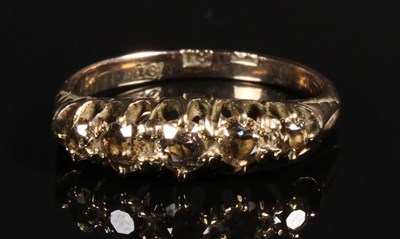 Lot 149 - An 18 carat yellow gold five stone diamond...