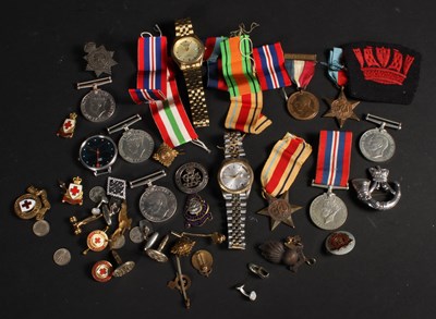 Lot 156 - A collection of wristwatches, medals and badges