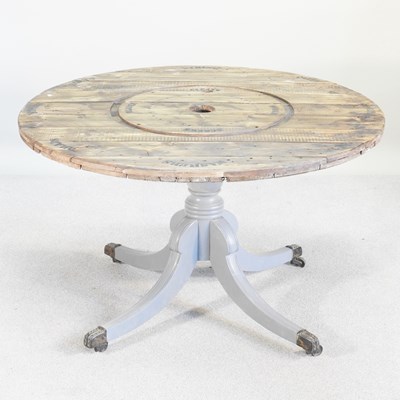 Lot 409 - A circular rustic centre table, on a painted...