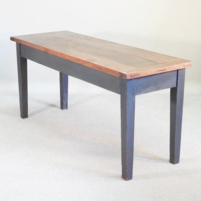 Lot 109 - An oak side table, with a plank top, on a blue...