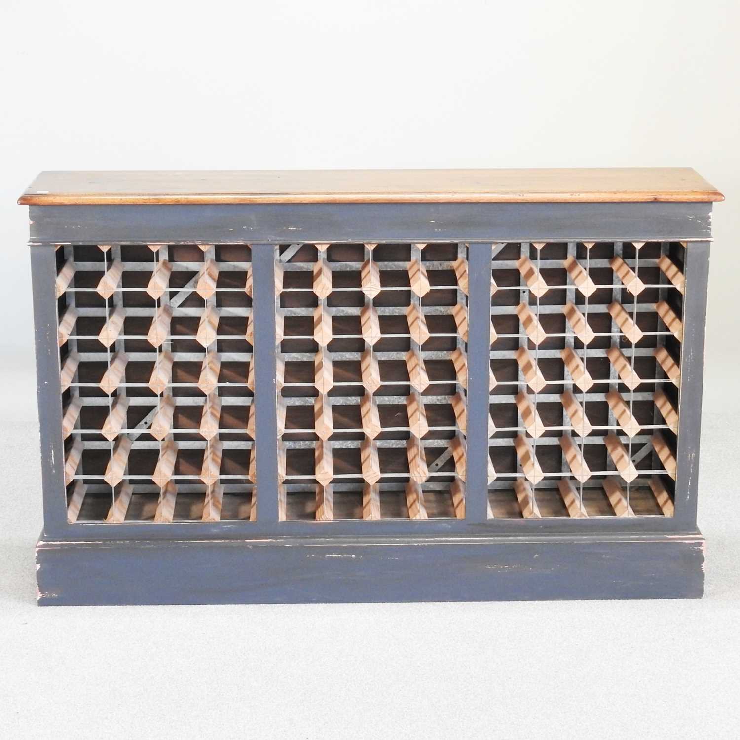 Lot 42 - A hand made oak and painted wine rack, to hold...
