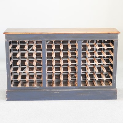 Lot 42 - A hand made oak and painted wine rack, to hold...
