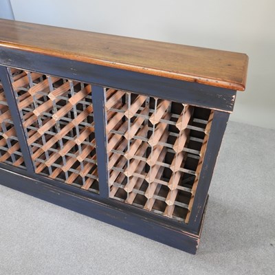 Lot 42 - A hand made oak and painted wine rack, to hold...