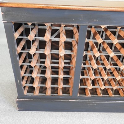 Lot 42 - A hand made oak and painted wine rack, to hold...